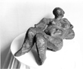 RECLINING WOMAN, Painted cement, 38cm (15in)