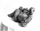 RECLINING WOMAN, Painted cement, 38cm (15in)