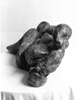 RECLINING WOMAN, Painted cement, 38cm (15in)