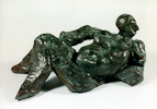 RECLINING WOMAN, Painted cement, 38cm (15in)